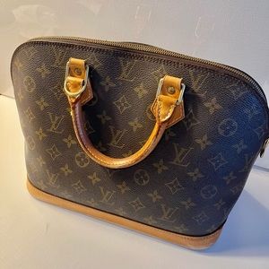 Authentic Louis Vuitton Alma/inside is super clean/wear on bottom corner